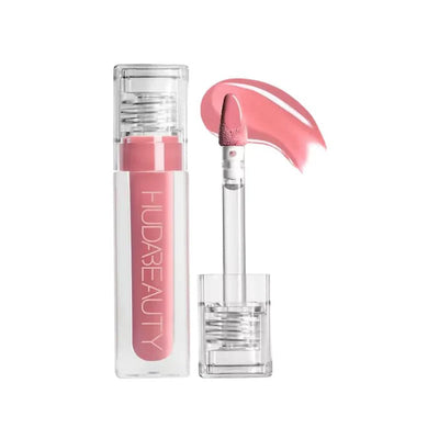 Huda Beauty Faux Filler gloss showing juicy reflective shine and applicator tip