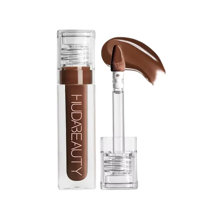 Huda Beauty Faux Filler gloss showing juicy reflective shine and applicator tip